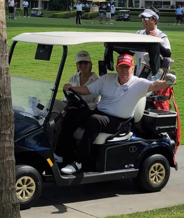 Trump driving a golf cart