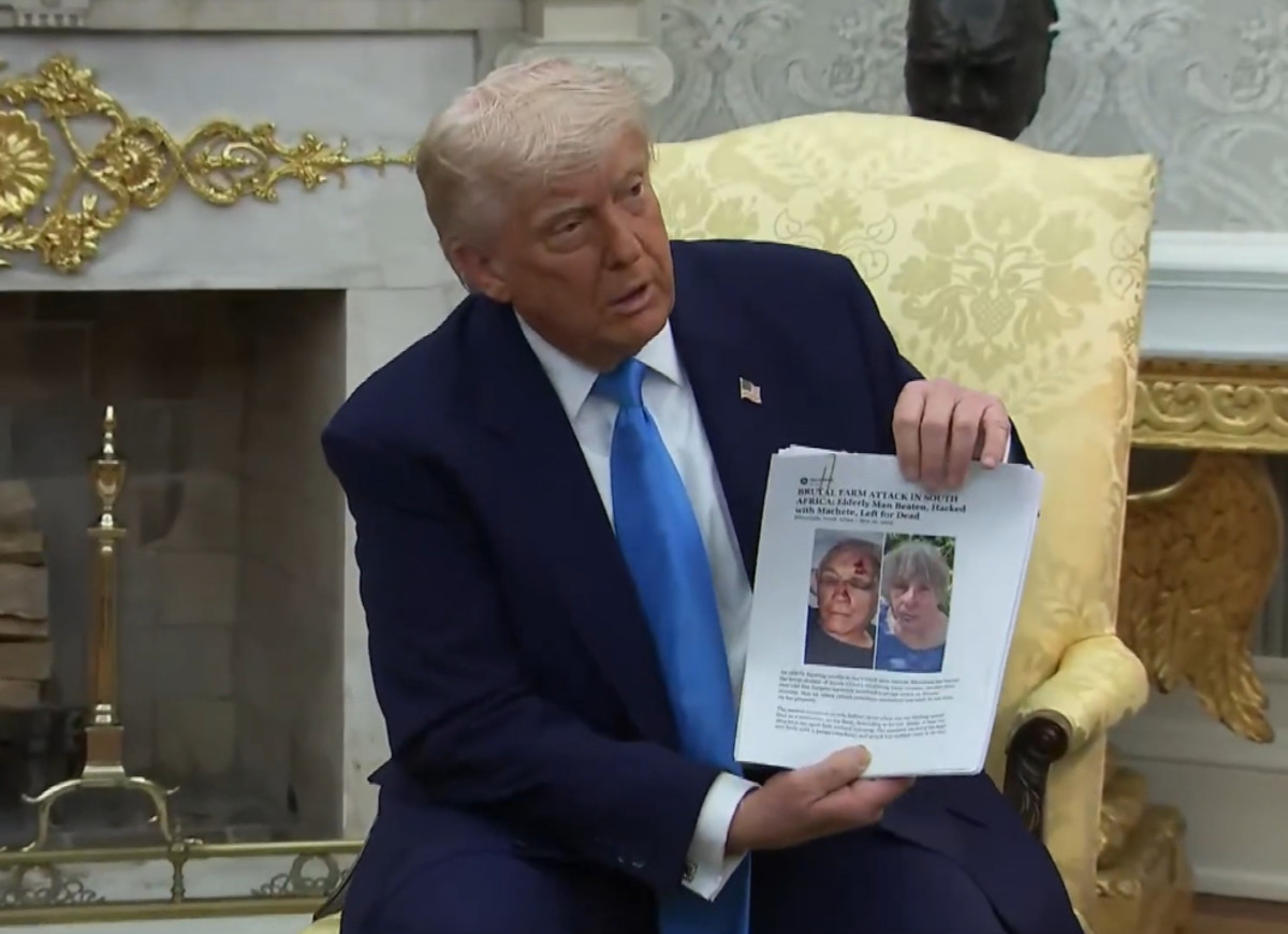 Trump holding up a Facebook post "article"